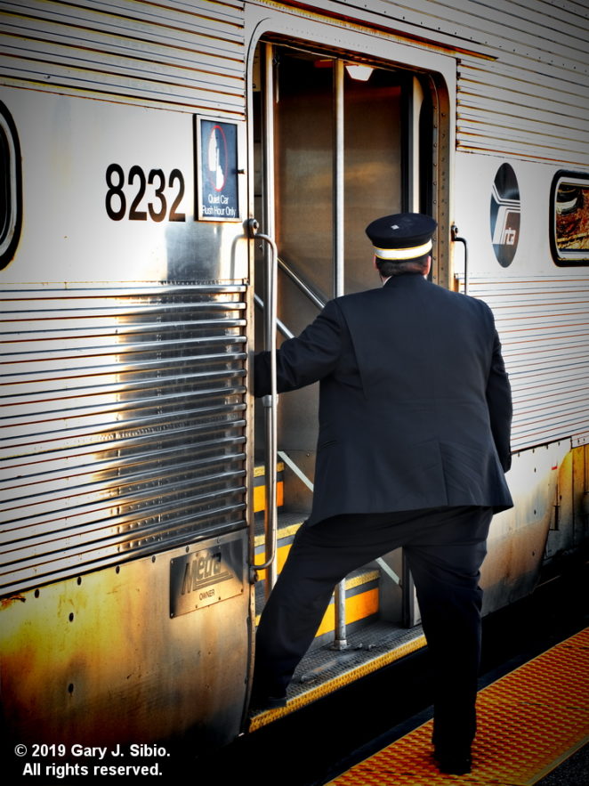 metra-train-conductor-during-a-stop-at-the-morton-grove-station-2019